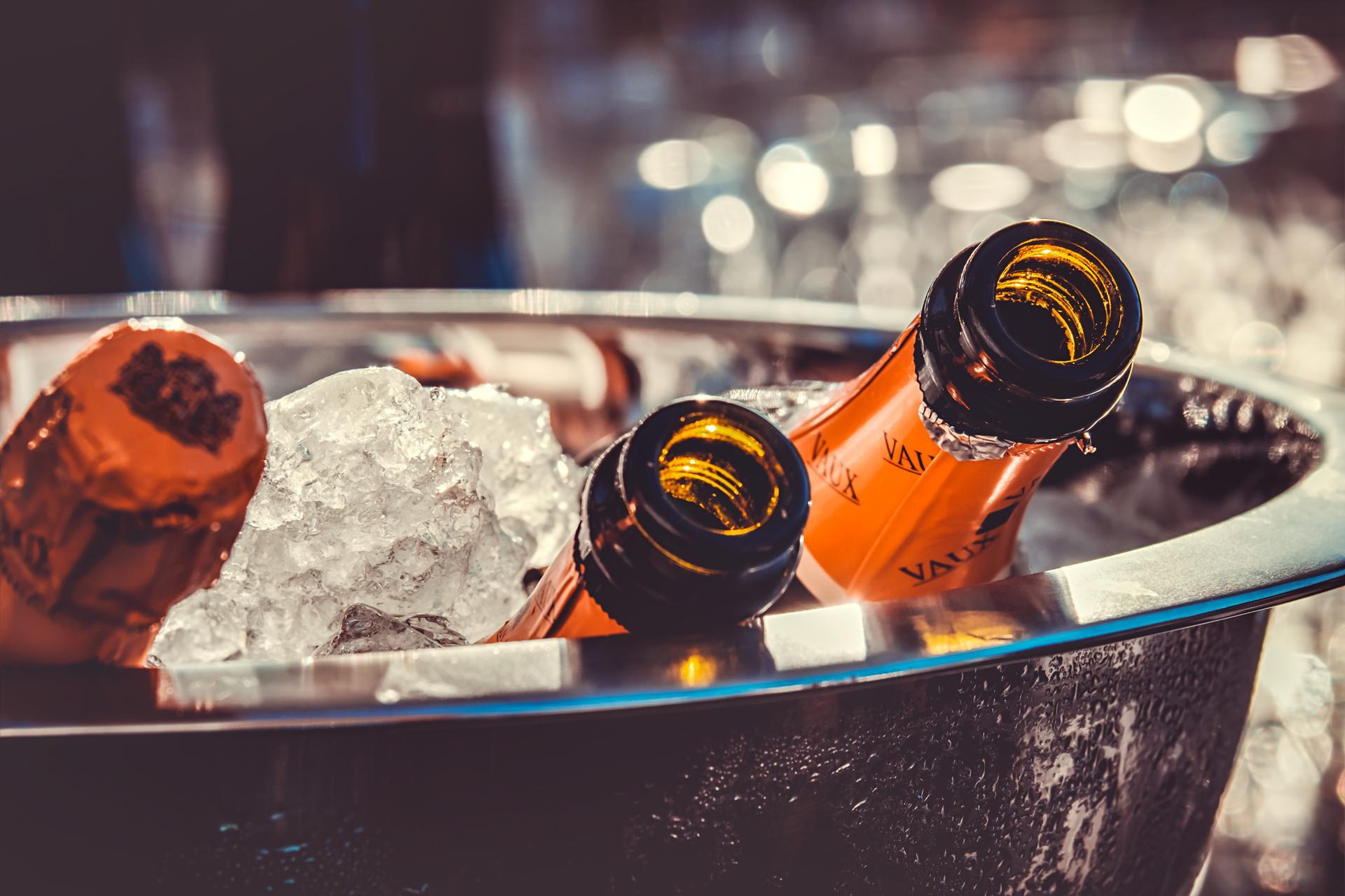 Champagne bottles on ice at a VIP event